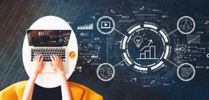 image SEO concept - person using a laptop with website performance icons floating next to it