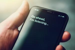 voice search image concept - phone with go ahead i'm listening on the screen