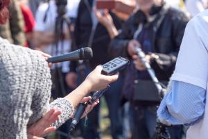 journalists and media interviews at a news conference